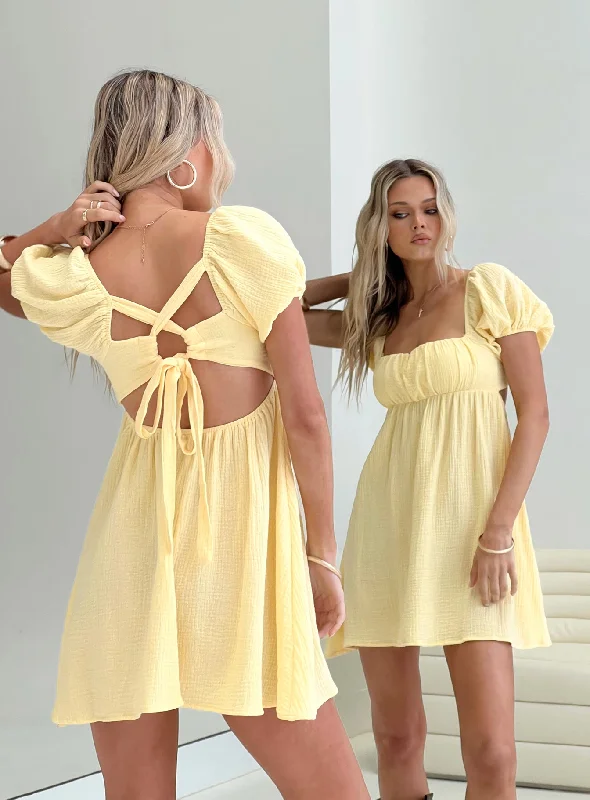 How to style a flowy dress for a cold spring day - -Flowy dresses with sustainable materials and innovative technology integration for modern style and sustainability -Let's Dance Mini Dress Yellow
