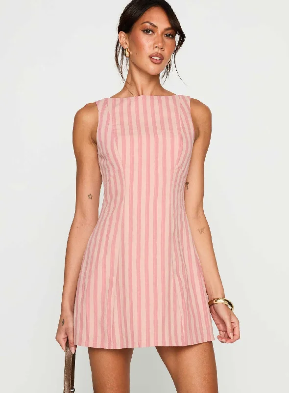 Flowy dresses for a feminine touch at a garden event - -Flowy dresses for summer with breathable and cooling fabrics for comfort and relaxation -Auggie Mini Dress Multi Flowy dresses for a feminine touch at a garden event - -Flowy dresses for summer with breathable and cooling fabrics for comfort and relaxation -Auggie Mini Dress Multi